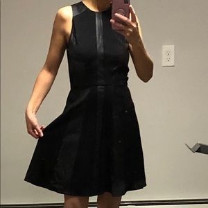 Classic black dress with faux leather panels